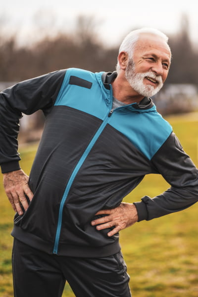 middle aged man stretching
