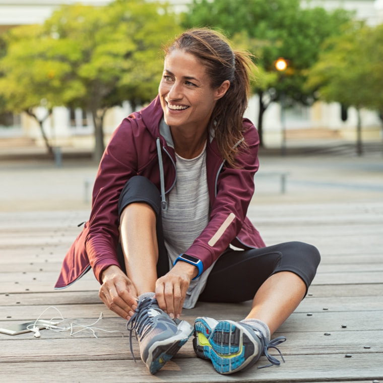 confident middle aged woman exercising