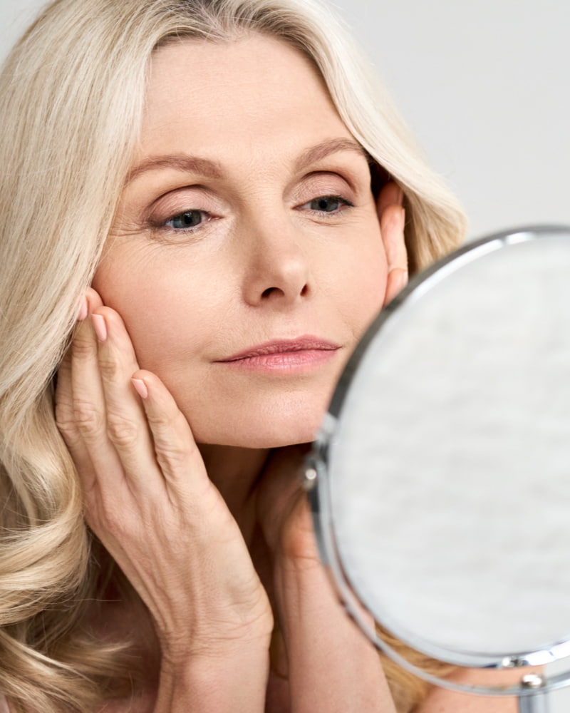 woman looking in the mirror