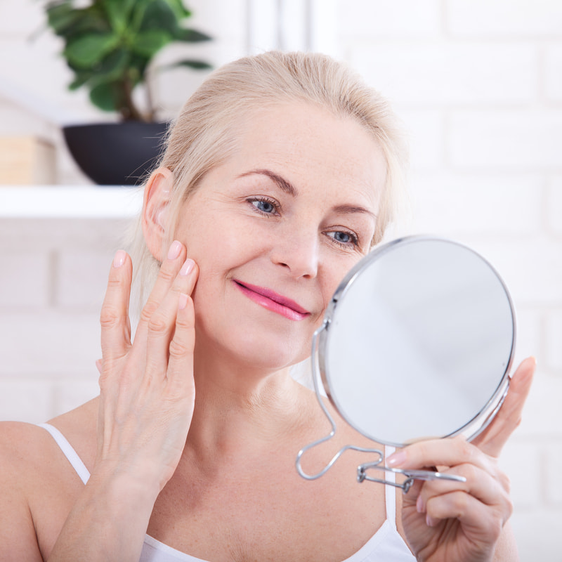 woman looking in the mirror