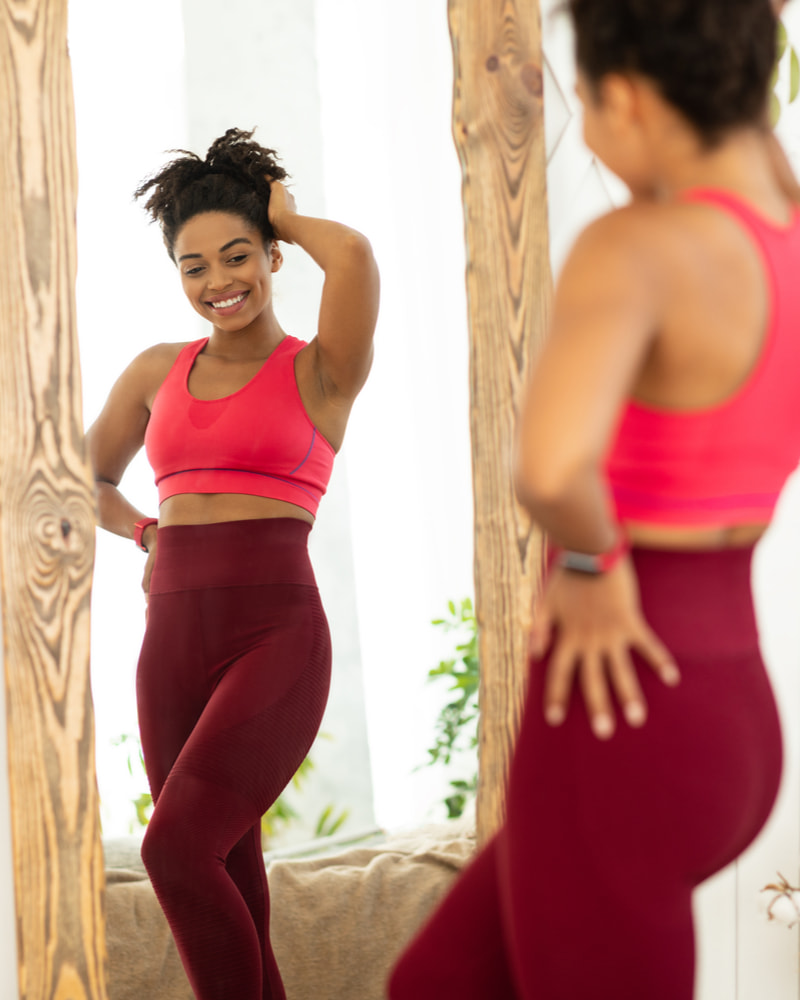 woman looking in the mirror