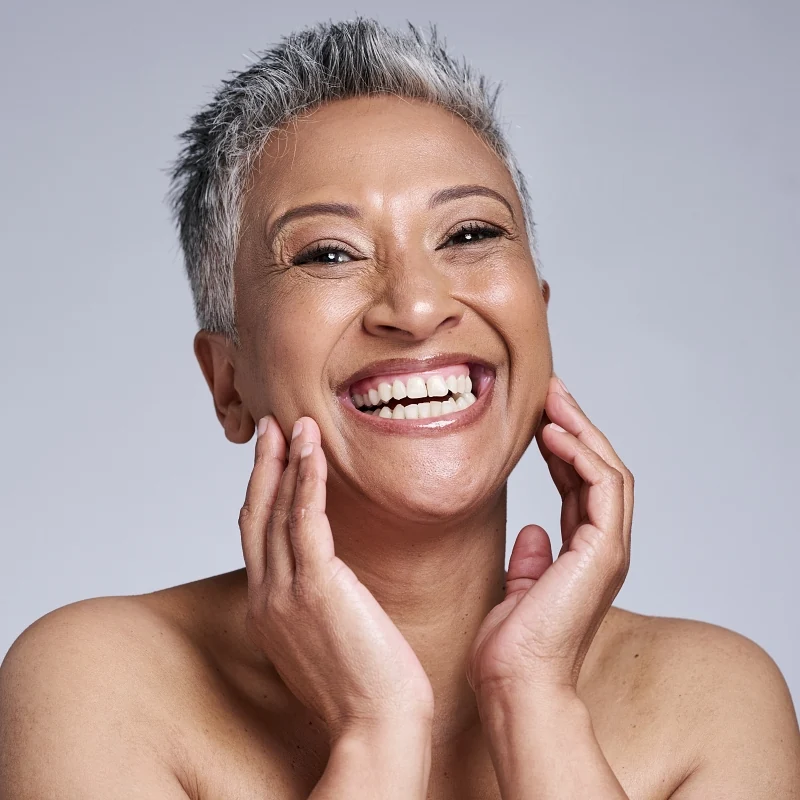 Middle age woman with short hair smiling happily
