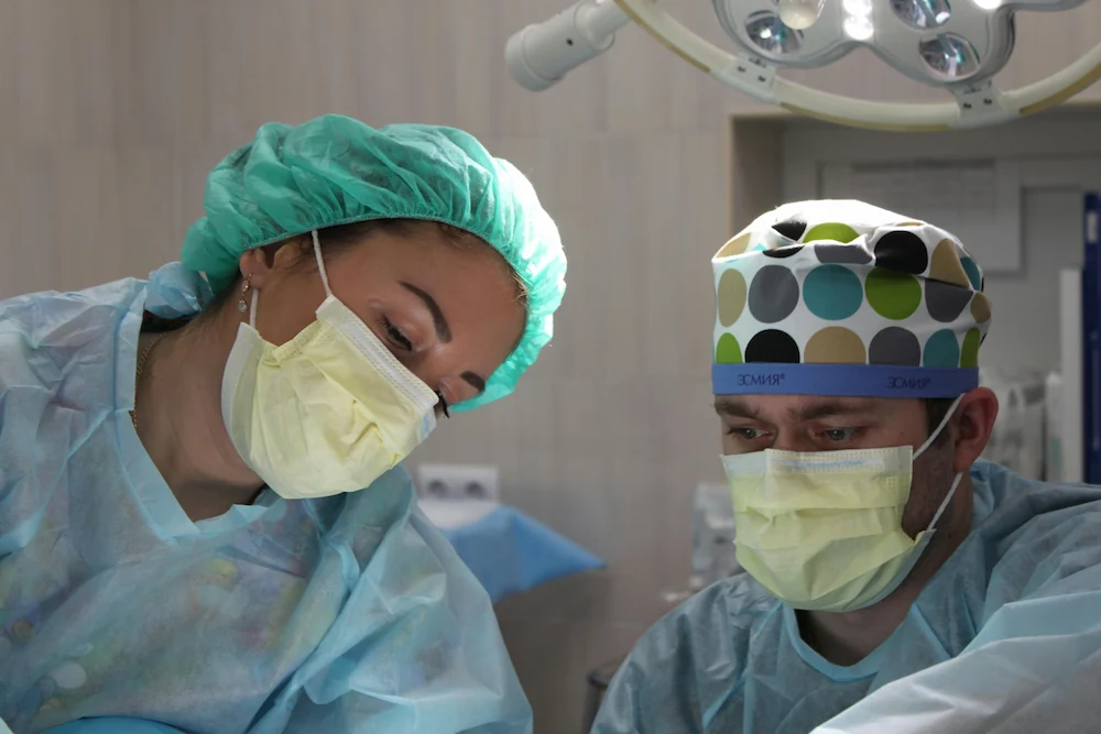 Two dedicated surgeons in an operating room