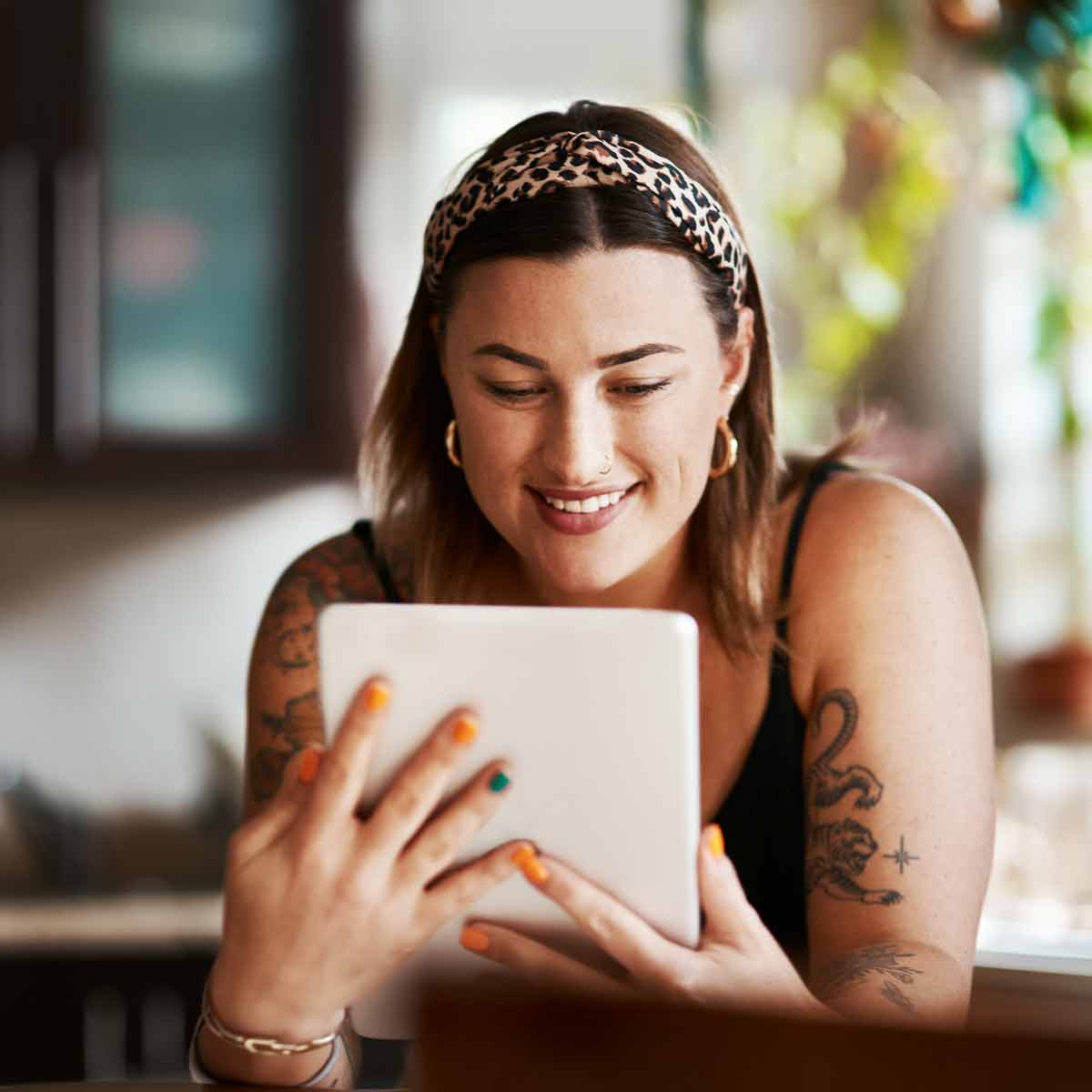woman researching on her ipad in the kitchen